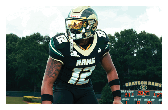 A group of football players wearing headphones and smiling. AI generated content