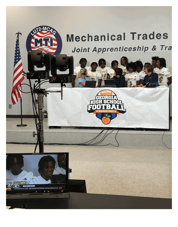 A football player wearing a helmet and white uniform is holding his helmet above his head. AI generated content