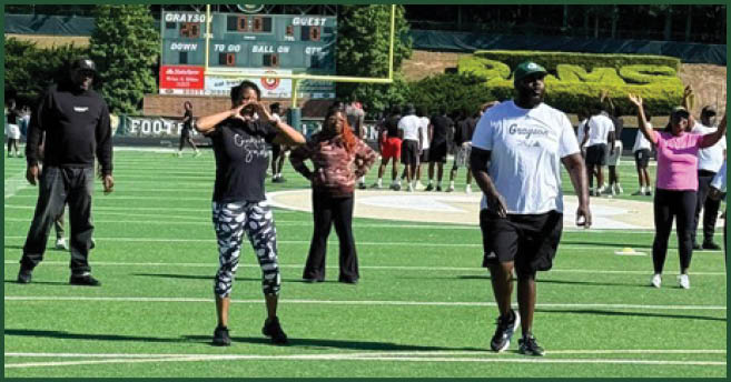 A football player wearing a blue and white uniform. Description generated by AI