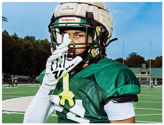 A group of football players on a field. Description generated by AI