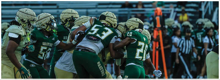 A football player is sliding on the ground. Description generated by AI