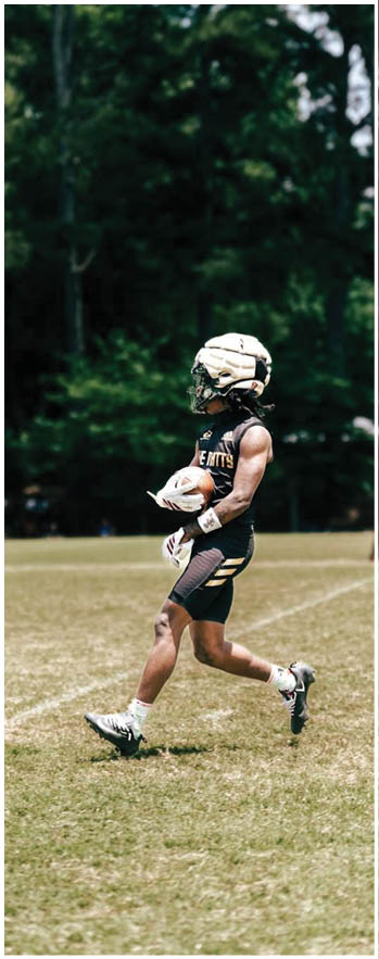 A football player running on the field. Description generated by AI