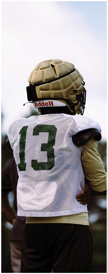 A football player running on the field. Description generated by AI