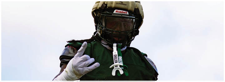 A football player is sliding on the ground. Description generated by AI