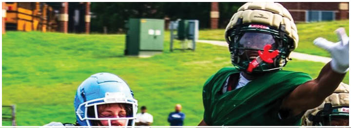 A football player is sliding on the ground. Description generated by AI