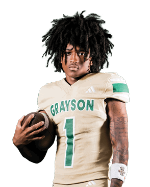 Person with curly hair wearing a football uniform holding a football and looking forward. Description generated by AI