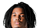 A young man wearing a white jersey with the number 10 on it. Description generated by AI