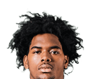 A young man wearing a white jersey with the number 10 on it. Description generated by AI