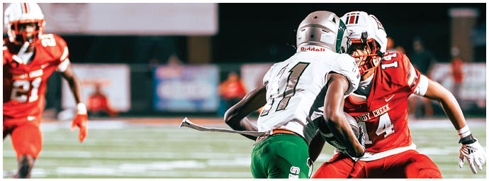 A scoreboard displays a time of 9:50 and a score with the home team leading 21 to 1. Description generated by AI