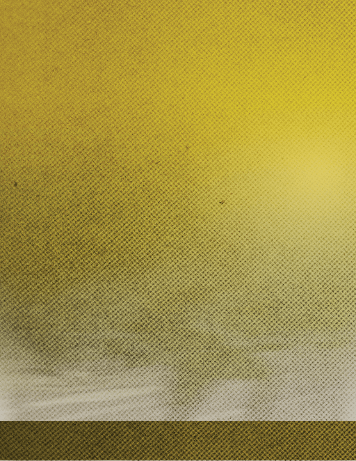 A yellowish-brown sky with a few clouds. Description generated by AI