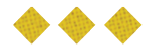 Three yellow diamond-shaped crackers with small holes arranged in a row on a white background. Description generated by AI