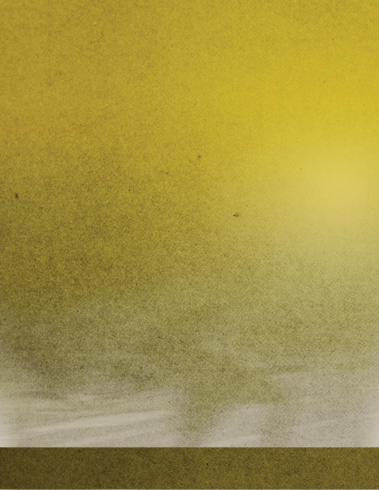 A yellowish-brown sky with a few clouds. Description generated by AI
