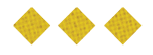 Three yellow diamond-shaped waffle crackers are arranged in a horizontal row on a white background. Description generated by AI