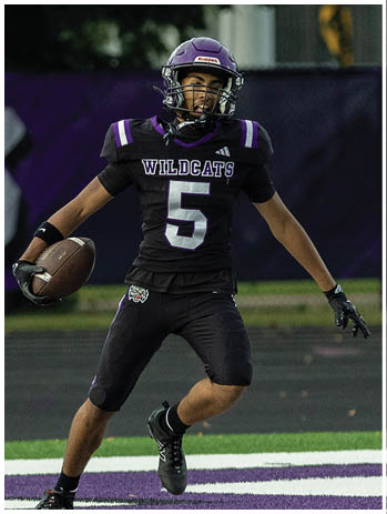 A football player wearing a blue jersey with the number 58 on it. Description generated by AI