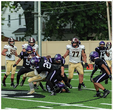 A football player running on the field. Description generated by AI