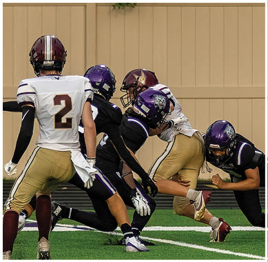 A football player running on the field. Description generated by AI