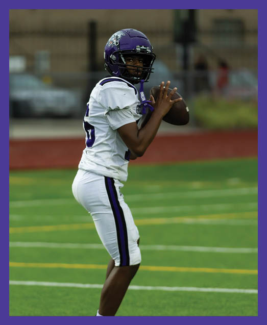 A football player in a white uniform is running with a football in his hand. AI generated content