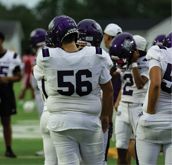 A group of football players celebrating a victory. AI generated content