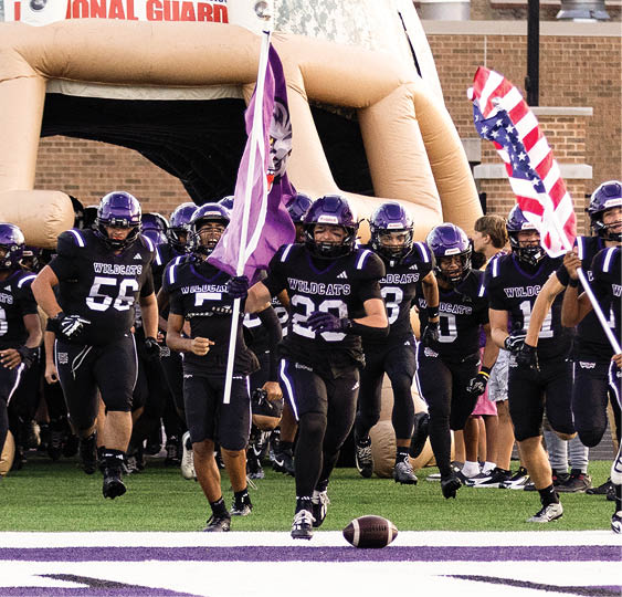 A group of football players celebrating a victory. AI generated content