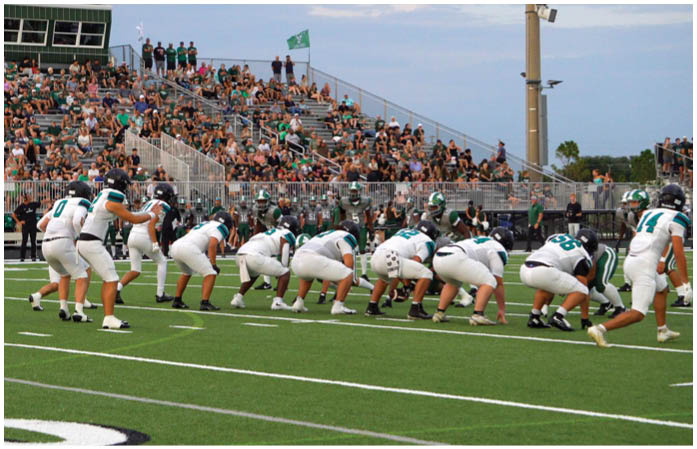 A football game is being played at Powell-Davis Stadium. Description generated by AI