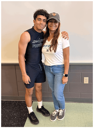 A man and woman standing together. Description generated by AI