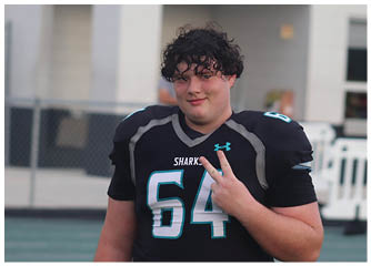 A man wearing a football jersey with the number 44 on it. Description generated by AI
