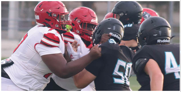 A football game is taking place on a field. Description generated by AI