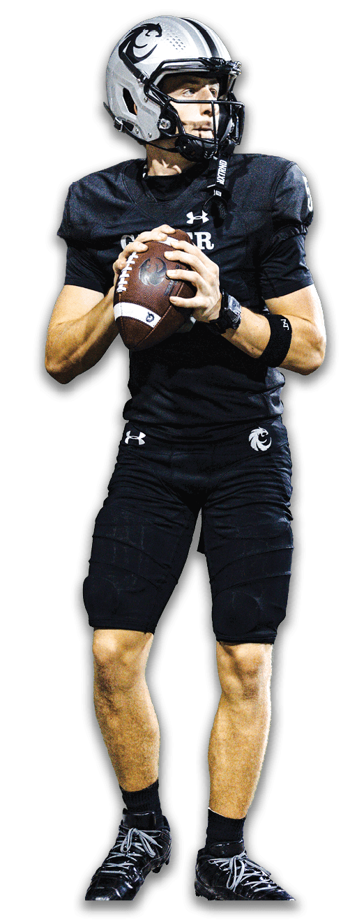 A person wearing a silver football helmet and black uniform is holding a football and looking to the side. Description generated by AI