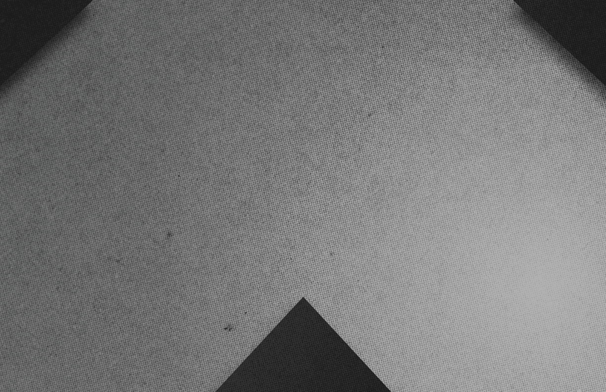 A red and black triangle. Description generated by AI