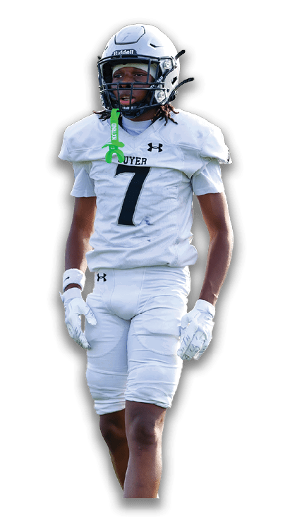 Person wearing a white football uniform with the number seven, a helmet, gloves, and gold cleats walking forward. Description generated by AI