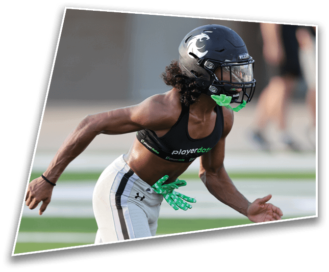 A person wearing a black sports helmet and a black sleeveless top is in an athletic stance, appearing ready to sprint or engage in a sport. Description generated by AI