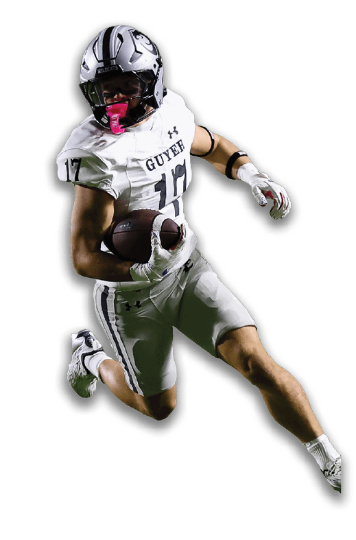 Two people in football gear are engaged in a play with one person running while holding the ball and the other person preparing to tackle. Description generated by AI