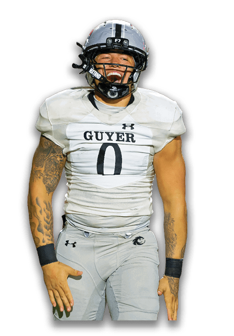 A person wearing a white football uniform with the word “GUYER" and the number zero on the jersey is smiling and standing with arms slightly extended. Description generated by AI