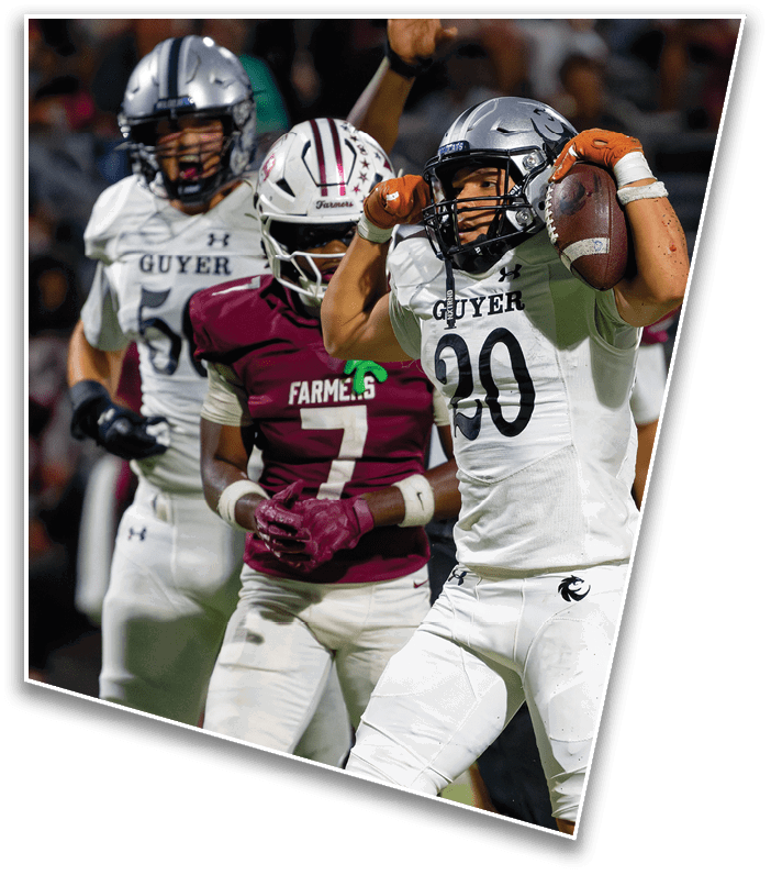 A person wearing a white football uniform with the number 20 is holding a football and appears to be running while another person in a maroon uniform is behind them with an arm raised. Description generated by AI