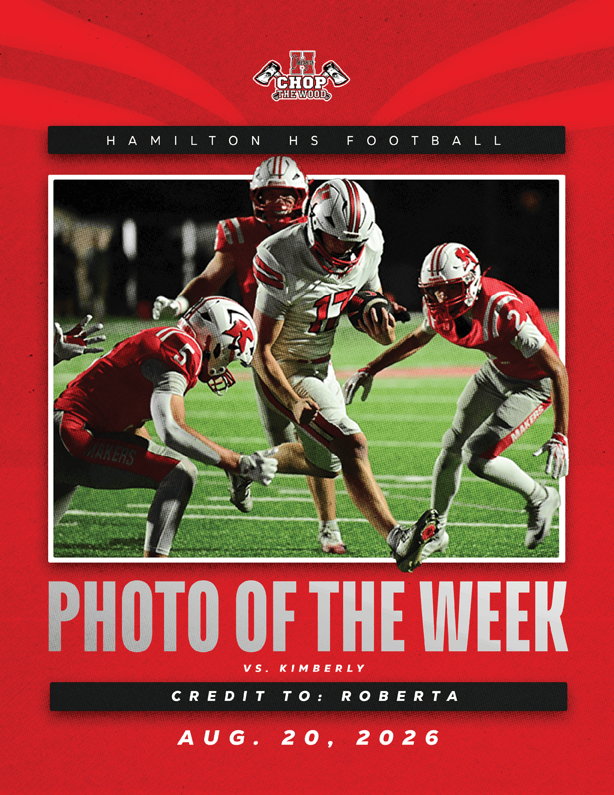 A group of football players in red and white uniforms are actively engaged in a game on a green field under stadium lights. Description generated by AI