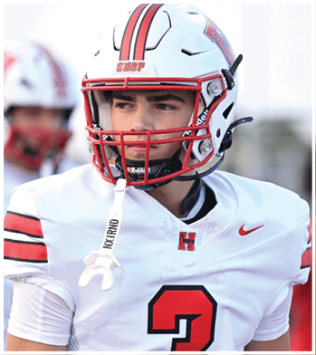 A person wearing a white football jersey with the number three and a white helmet with a red faceguard is looking to the side. Description generated by AI