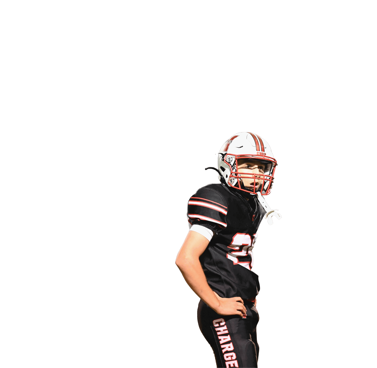 A person wearing a black football uniform with red and white stripes and a white helmet stands with one hand on their hip. Description generated by AI