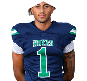 A young man wearing a white jersey with the number 10 on it. Description generated by AI