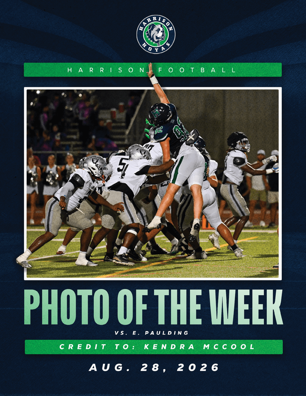 A football player in a green jersey is jumping in the air. Description generated by AI
