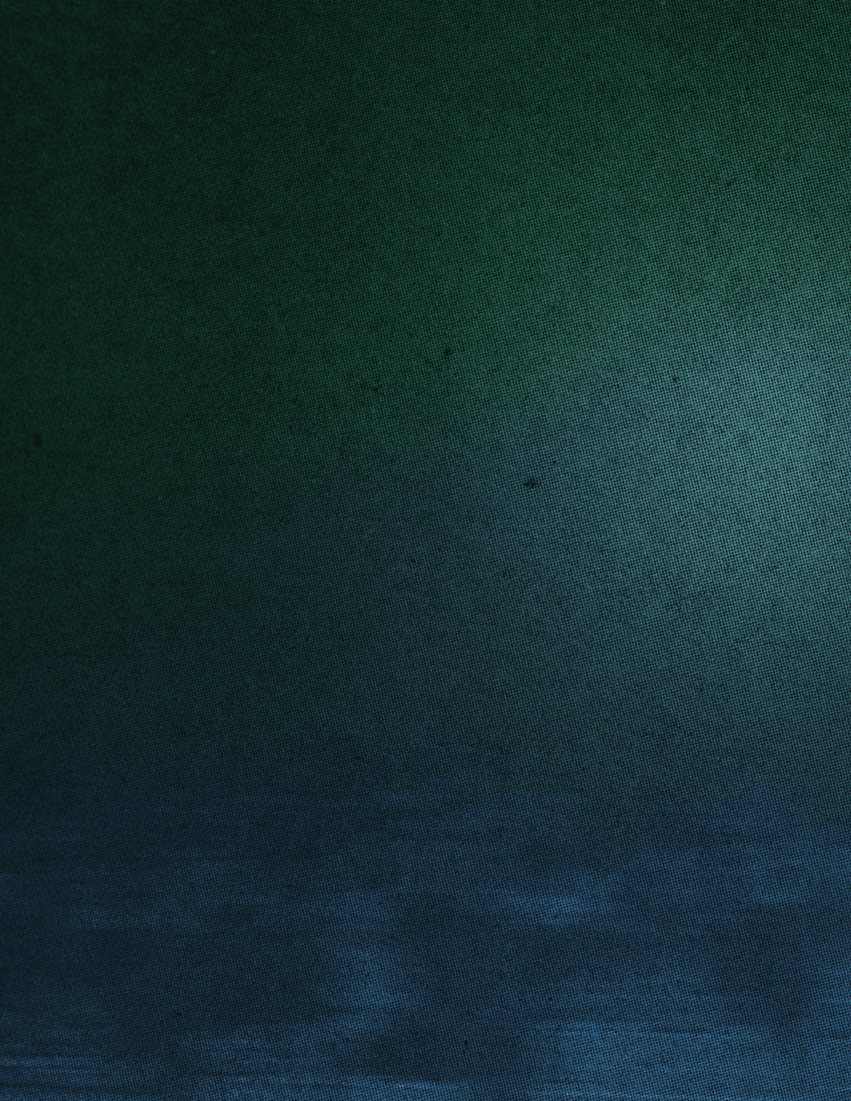 A yellowish-brown sky with a few clouds. Description generated by AI