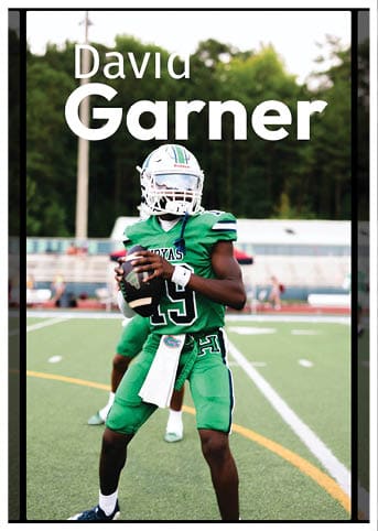 A football player wearing a blue and red jersey. Description generated by AI