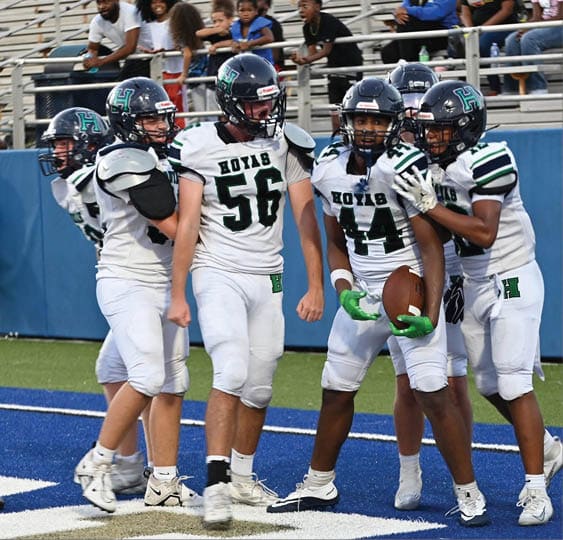 A group of football players celebrating a victory. AI generated content