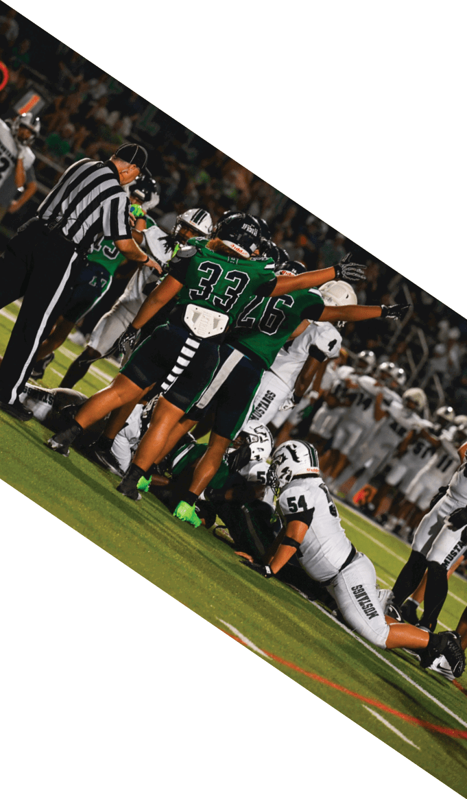A group of people wearing black jerseys are huddled together on a field. AI generated content