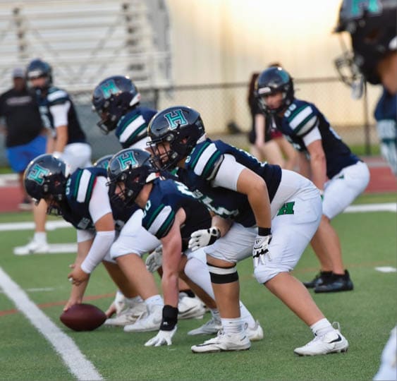 A group of football players celebrating a victory. AI generated content