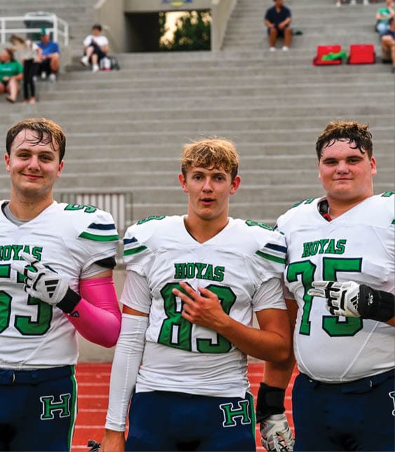 A group of football players celebrating a victory. AI generated content