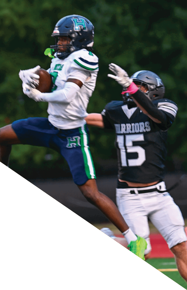 A football player is kneeling on the field, holding his helmet in his hands. AI generated content