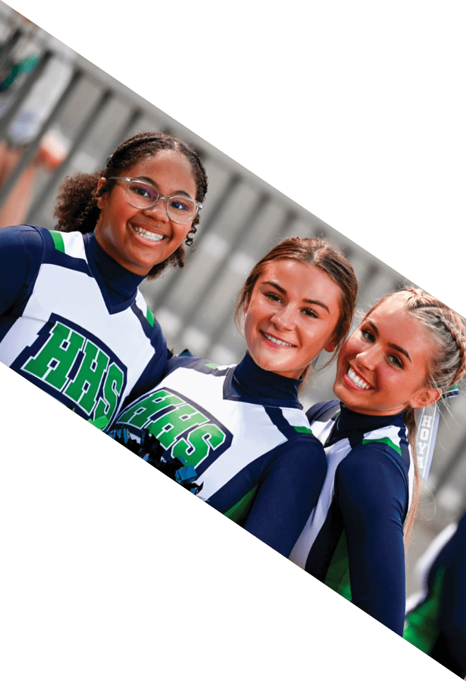 Three football players wearing green uniforms and black helmets pose for a photo. AI generated content