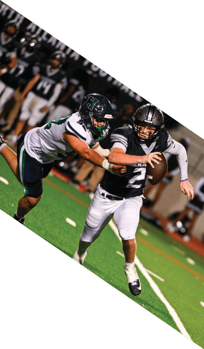 A group of people wearing black jerseys are huddled together on a field. AI generated content