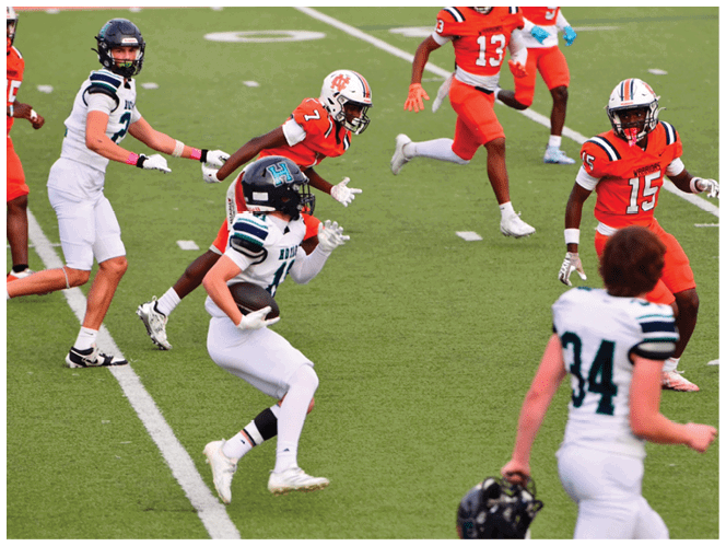 A group of football players in black and white uniforms are on the field. AI generated content