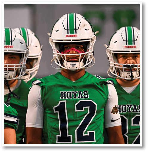 A group of men wearing black and white jerseys. Description generated by AI